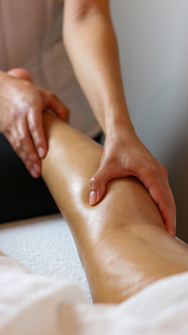 Hands Massaging a Person's Leg